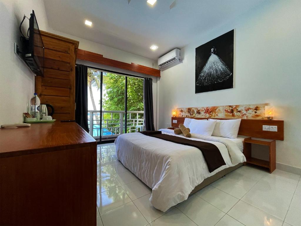 TV a/nebo společenská místnost v ubytování Paradise Retreat, Maafushi