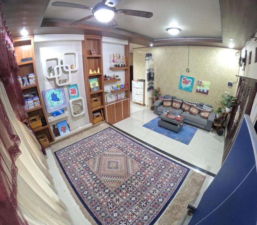 an aerial view of a living room with a rug at Omah Wirokerten Syariah Homestay Jogja in Gondowulung