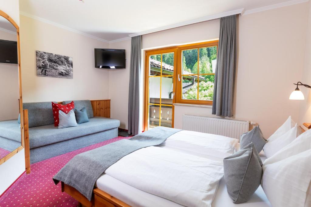 Postel nebo postele na pokoji v ubytování Gästehaus Pilz Schladming
