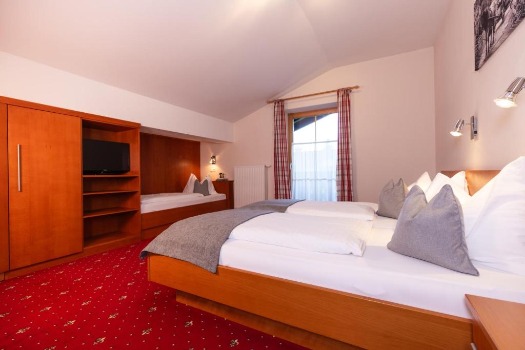 Postel nebo postele na pokoji v ubytování Gästehaus Pilz Schladming