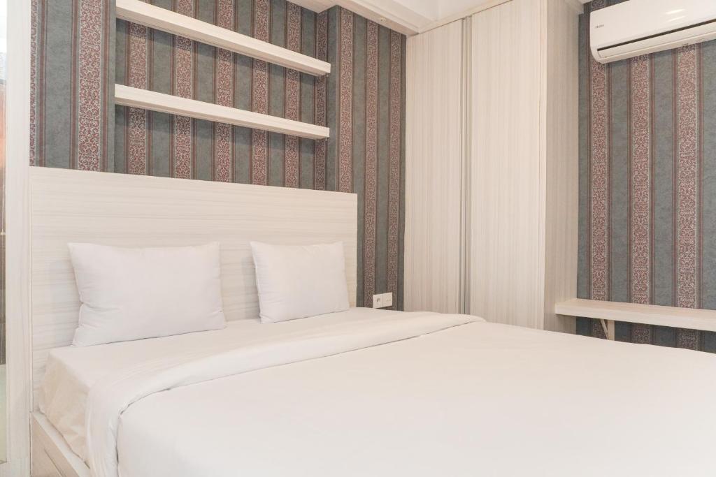 Ένα ή περισσότερα κρεβάτια σε δωμάτιο στο Scenic and Comfortable 2BR Sky Terrace Apartment By Travelio