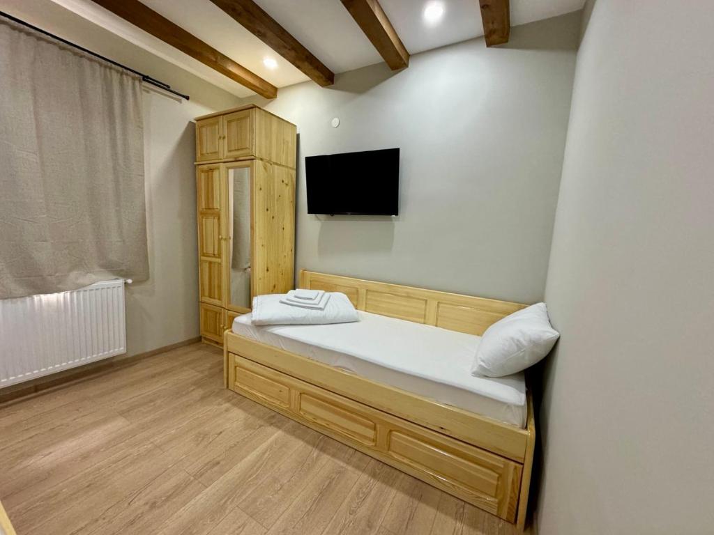 Postel nebo postele na pokoji v ubytování Петропавловската Къща