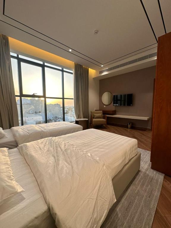 Postel nebo postele na pokoji v ubytování فندق الياس - Yas Hotel