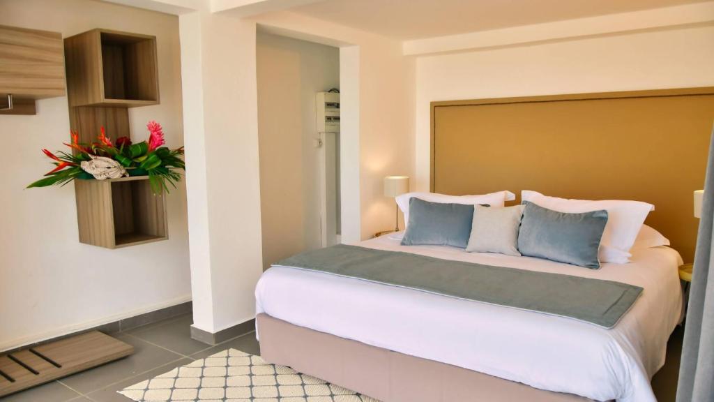 Postel nebo postele na pokoji v ubytování Le Gaetana Hotel