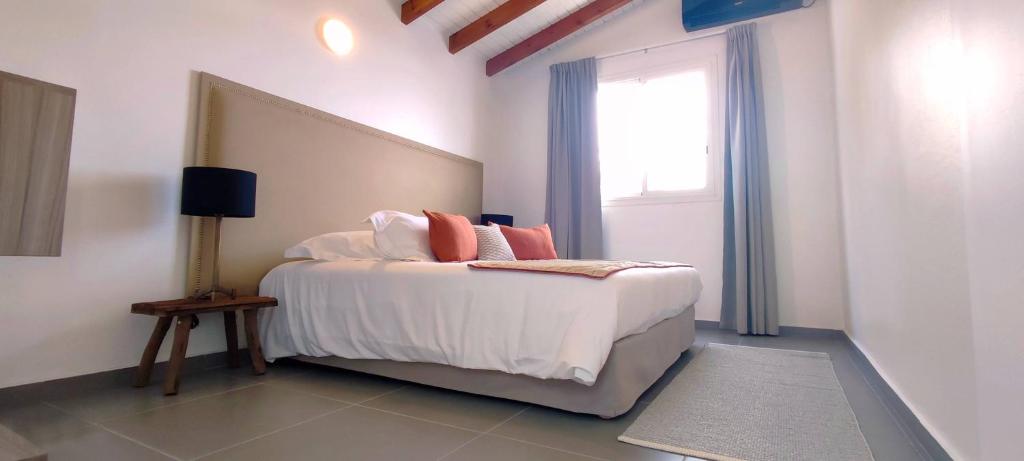 Postel nebo postele na pokoji v ubytování Le Gaetana Hotel