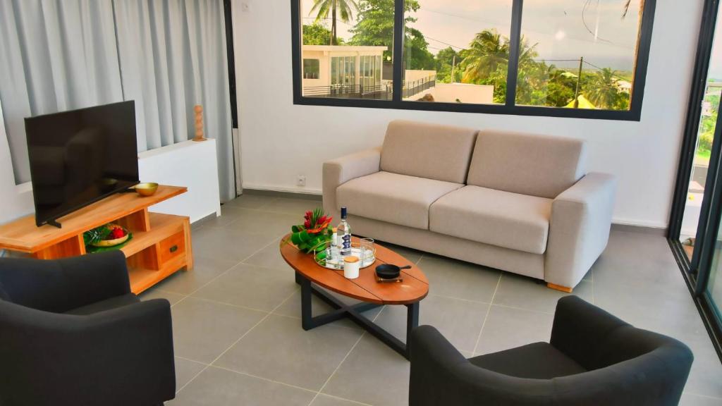 TV a/nebo společenská místnost v ubytování Le Gaetana Hotel