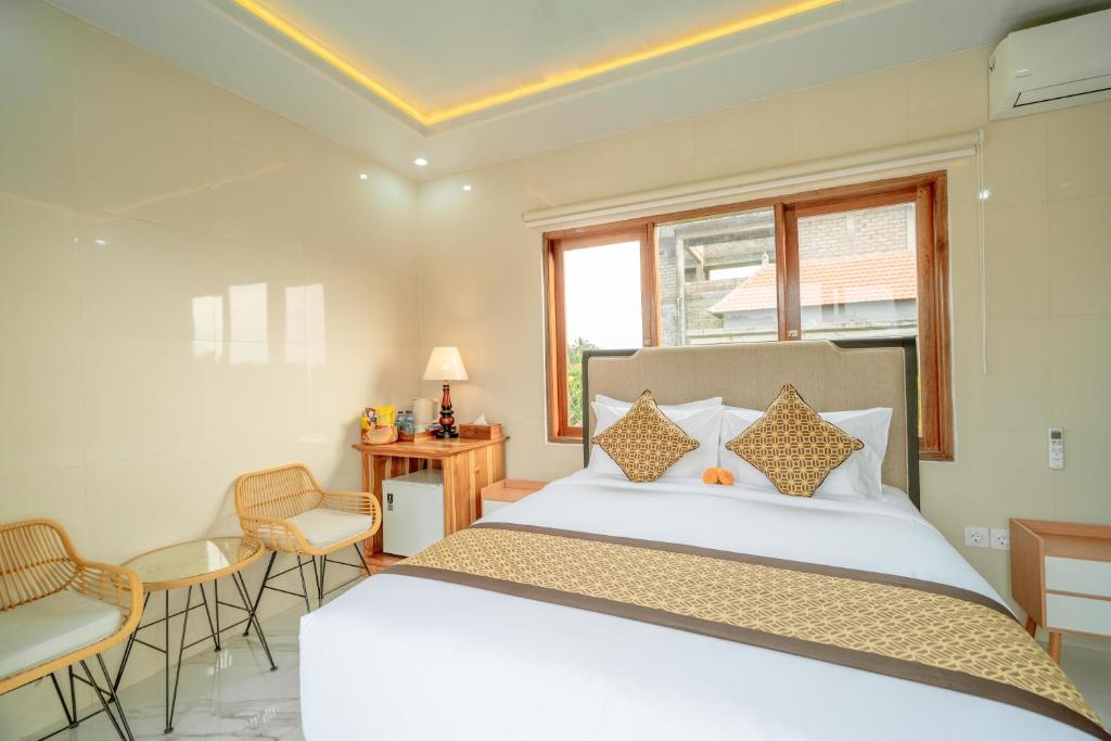 Postel nebo postele na pokoji v ubytování Ashanti Guest House Ubud