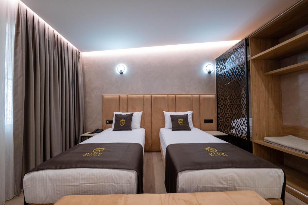 Postel nebo postele na pokoji v ubytování Hotel Dior