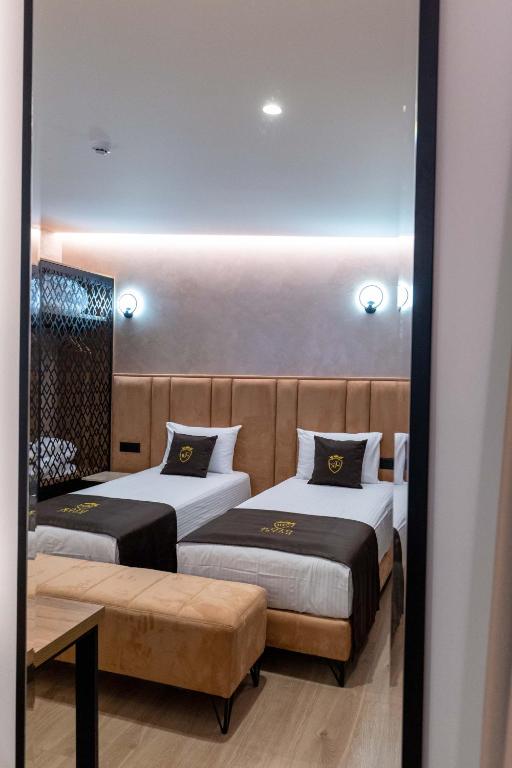 Postel nebo postele na pokoji v ubytování Hotel Dior
