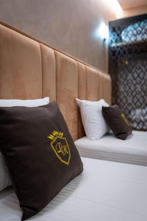 Postel nebo postele na pokoji v ubytování Hotel Dior