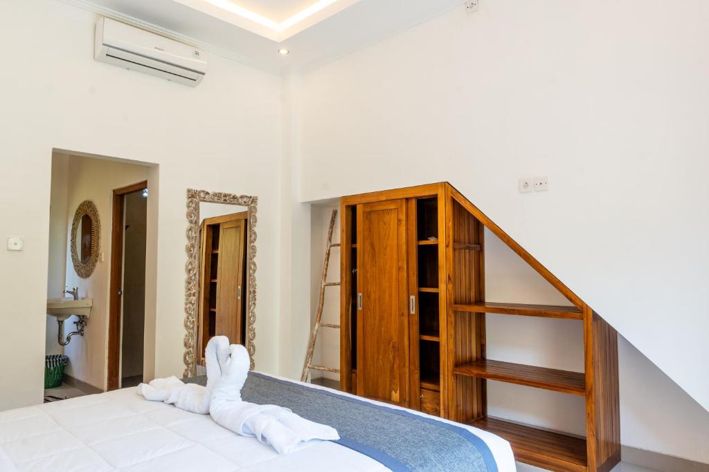 Postel nebo postele na pokoji v ubytování Ubud Ayu