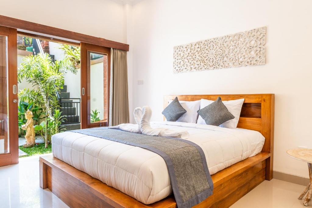 Postel nebo postele na pokoji v ubytování Ubud Ayu