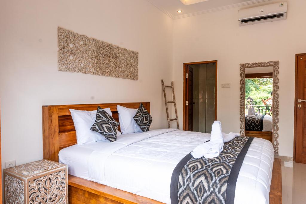 Postel nebo postele na pokoji v ubytování Ubud Ayu