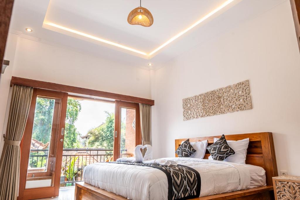 Postel nebo postele na pokoji v ubytování Ubud Ayu