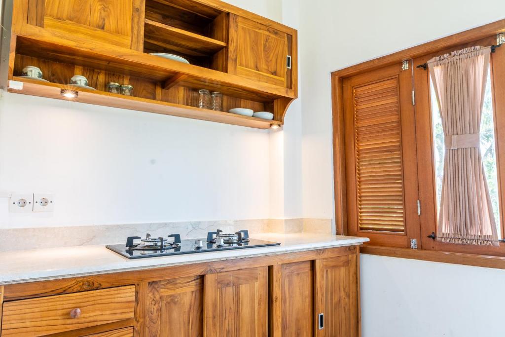 Kuchyň nebo kuchyňský kout v ubytování Ubud Ayu