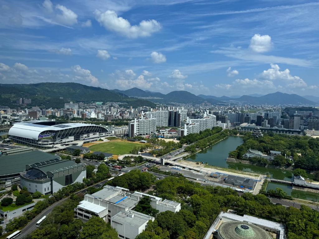 an aerial view of a city with buildings and a river at Rihga Royal Hotel Hiroshima in Hiroshima