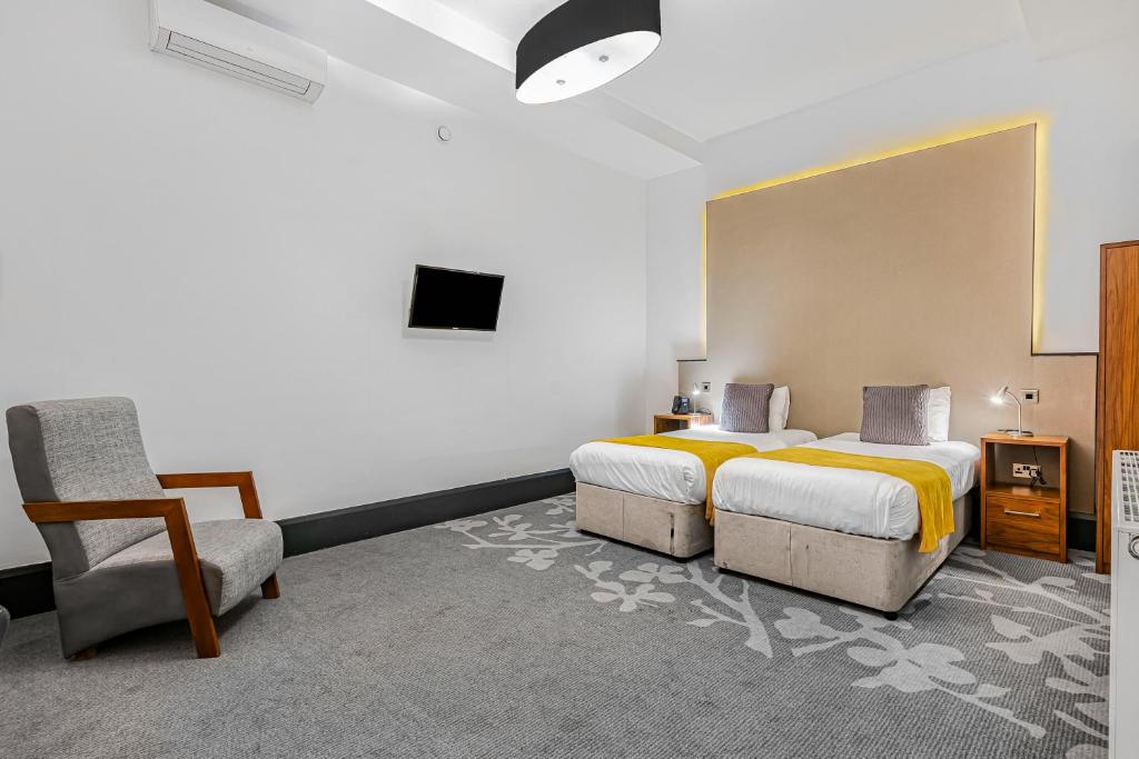 TV a/nebo společenská místnost v ubytování The Ainscow Hotel