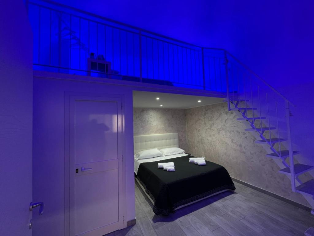 Ένα ή περισσότερα κρεβάτια σε δωμάτιο στο La Perla di Ele