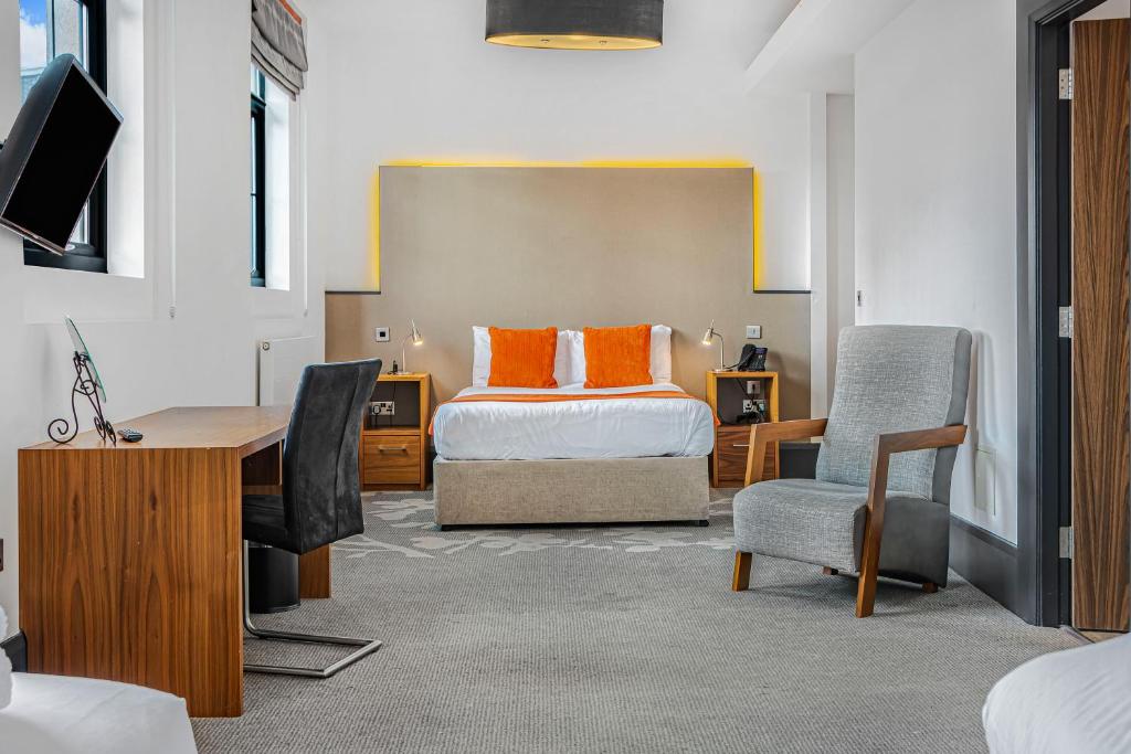 Postel nebo postele na pokoji v ubytování The Ainscow Hotel