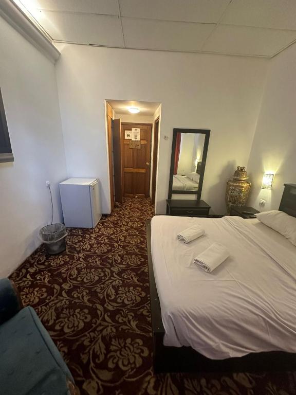 Postel nebo postele na pokoji v ubytování Zion Hotel