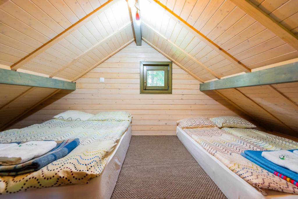 Ένα ή περισσότερα κρεβάτια σε δωμάτιο στο Natura Haziko