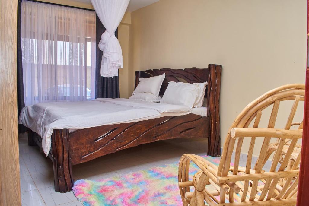 Postel nebo postele na pokoji v ubytování Ligen Suites