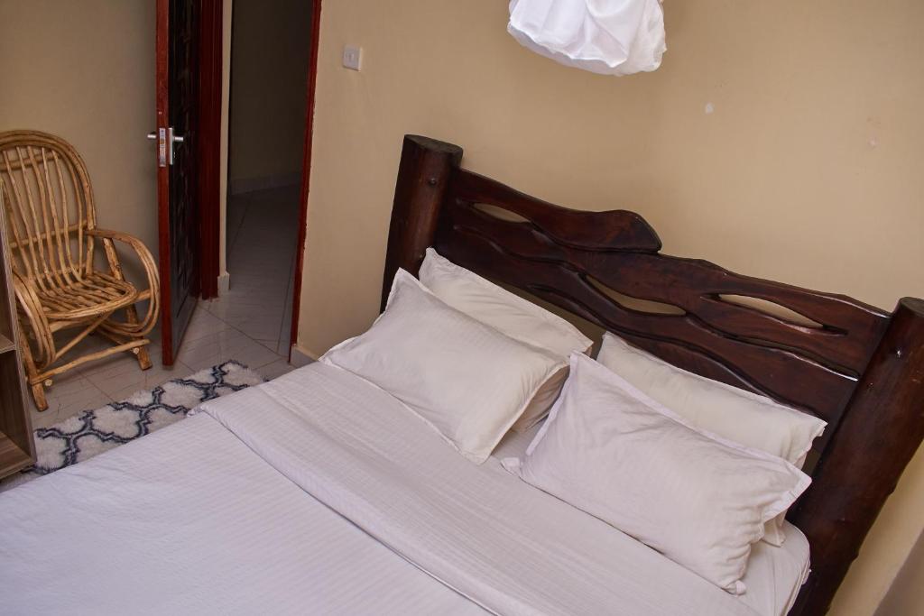 Postel nebo postele na pokoji v ubytování Ligen Suites