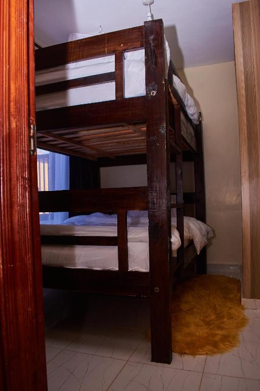 Postel nebo postele na pokoji v ubytování Ligen Suites