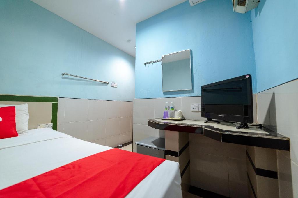 Postel nebo postele na pokoji v ubytování OYO 90208 Milion Inn