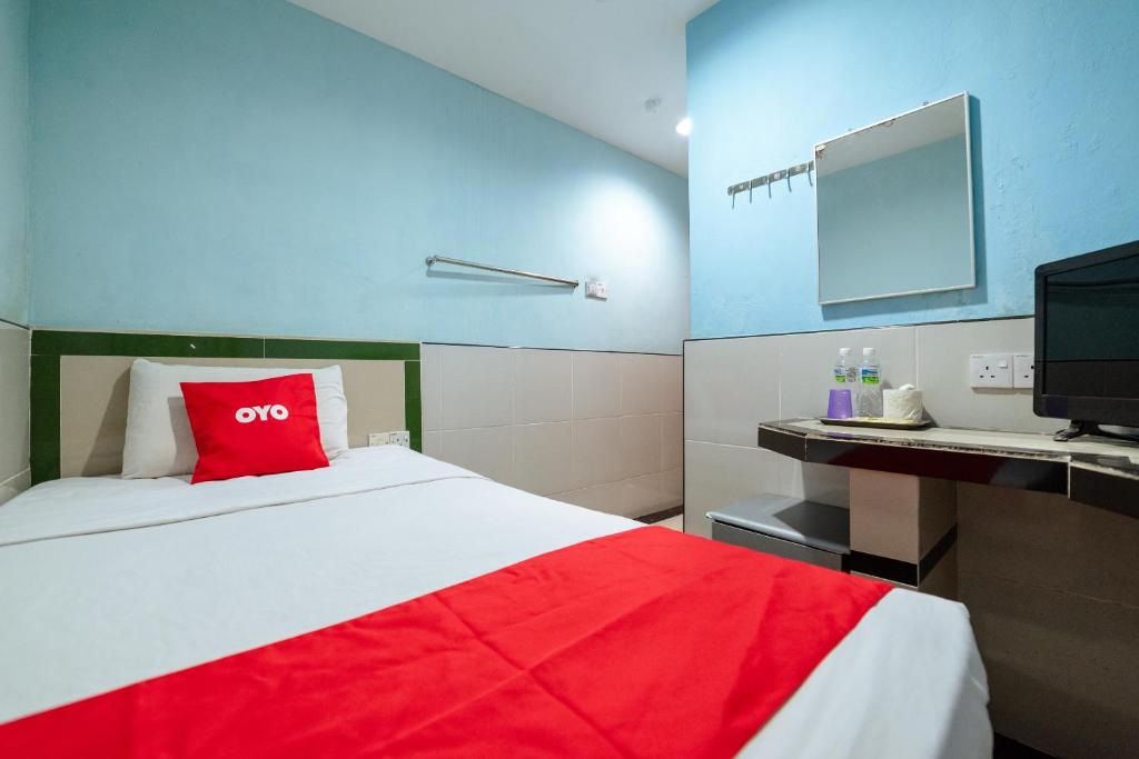 Postel nebo postele na pokoji v ubytování OYO 90208 Milion Inn