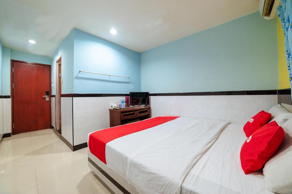 Postel nebo postele na pokoji v ubytování OYO 90208 Milion Inn
