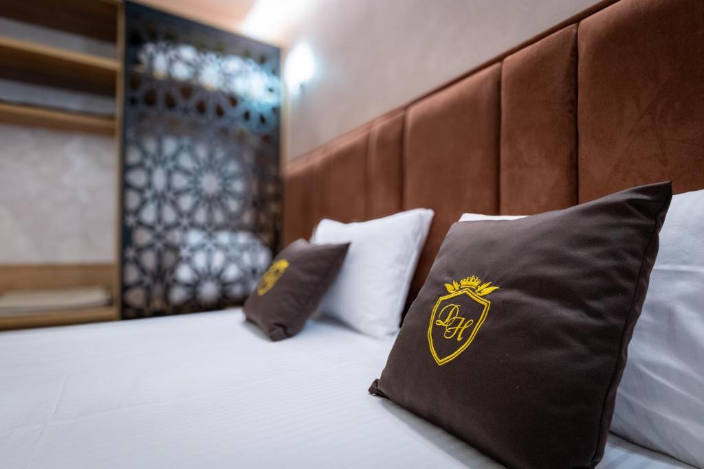 Postel nebo postele na pokoji v ubytování Hotel Dior