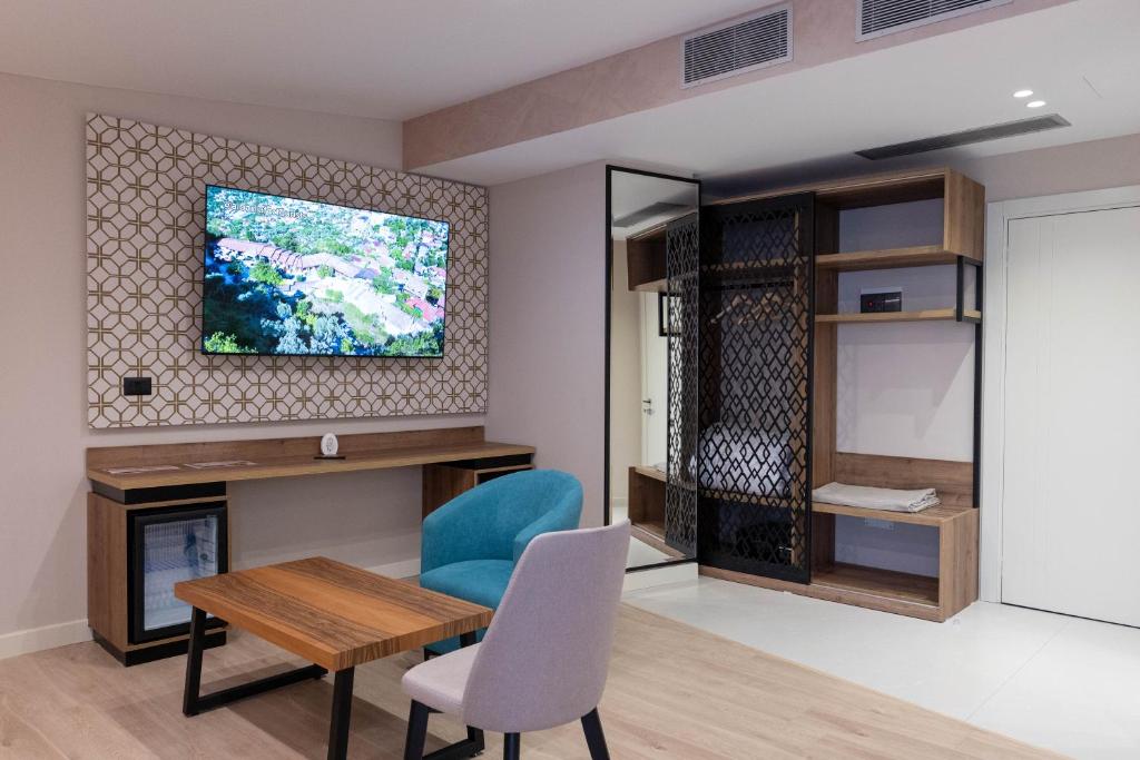 TV a/nebo společenská místnost v ubytování Hotel Dior