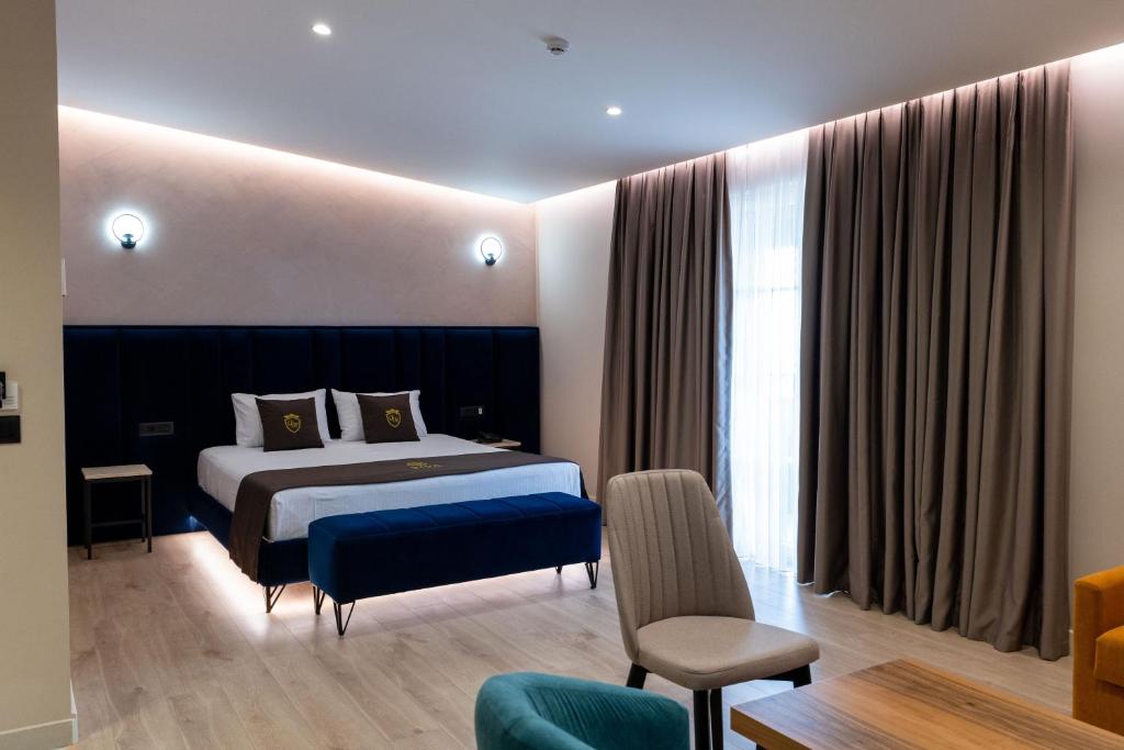 Postel nebo postele na pokoji v ubytování Hotel Dior