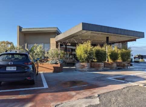 a car parked in a parking lot in front of a building at Treetops-Large Home 9km to CBD Sleeps 10 in Hobart