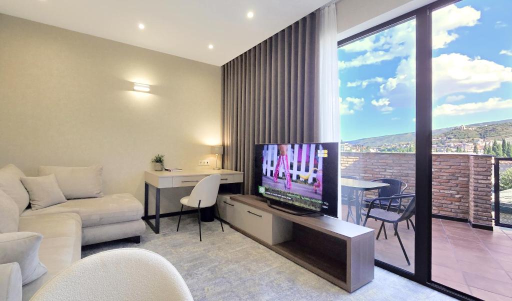 TV a/nebo společenská místnost v ubytování Griffin Hotel