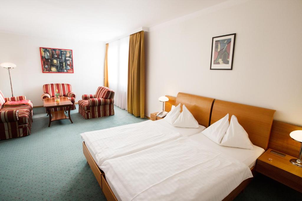 Postel nebo postele na pokoji v ubytování Hotel Exel
