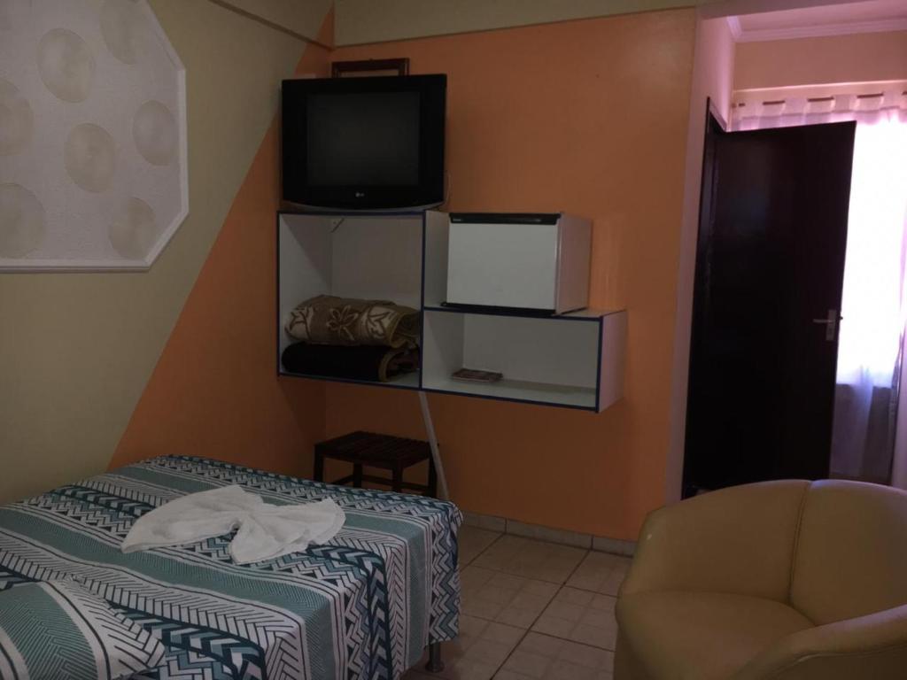 Postel nebo postele na pokoji v ubytování Hotel São Luis