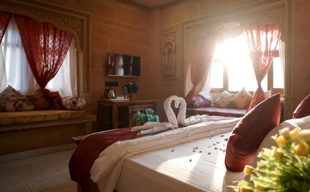 Postel nebo postele na pokoji v ubytování Hotel Golden Signature