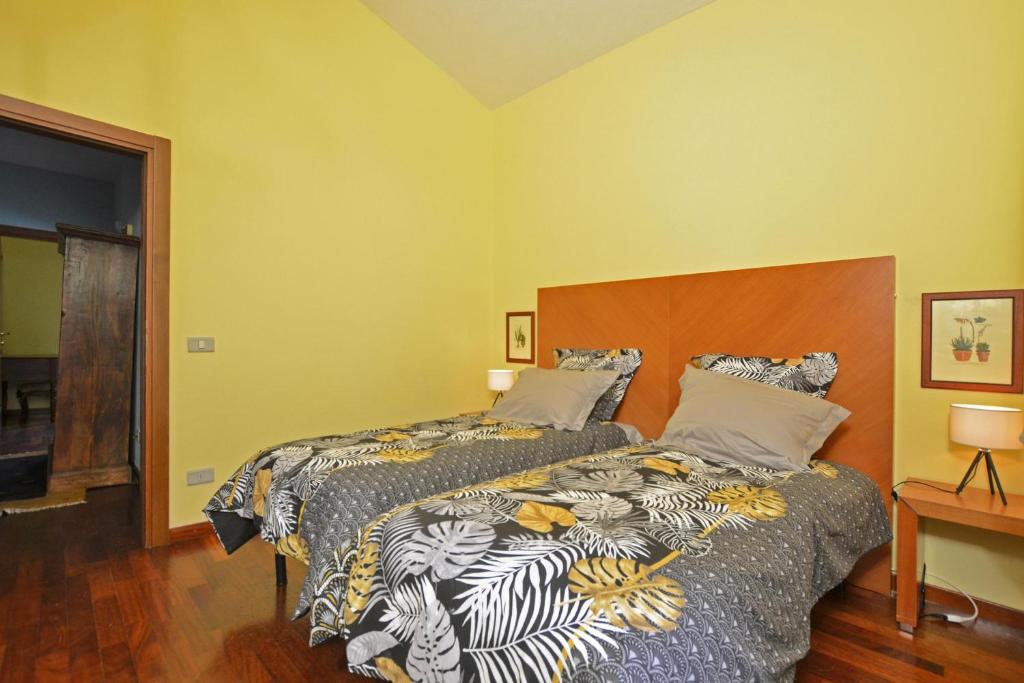 Łóżko lub łóżka w pokoju w obiekcie Certosa Homes