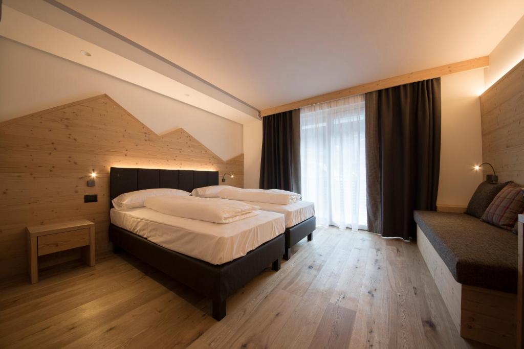 Postel nebo postele na pokoji v ubytování Monroc Hotel