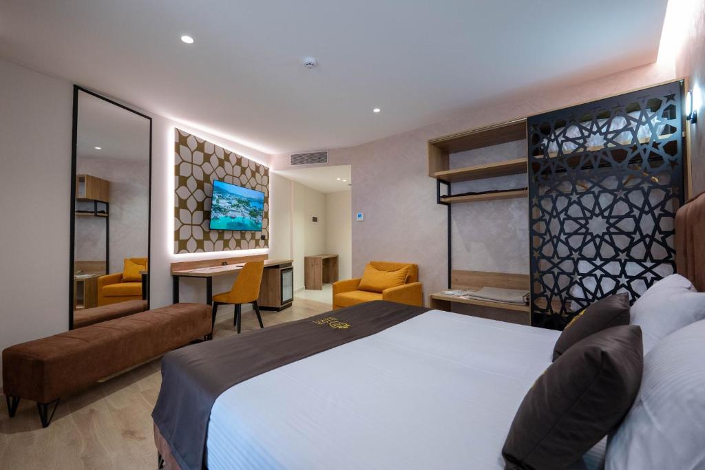 Postel nebo postele na pokoji v ubytování Hotel Dior