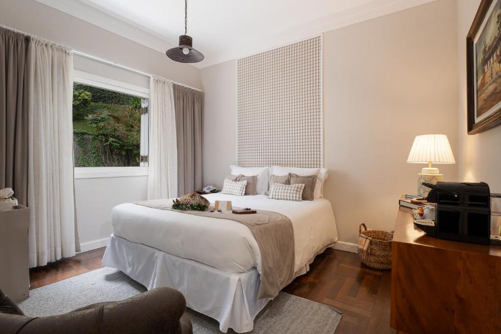 Secreto Boutique Hotel - Jardim e lareira