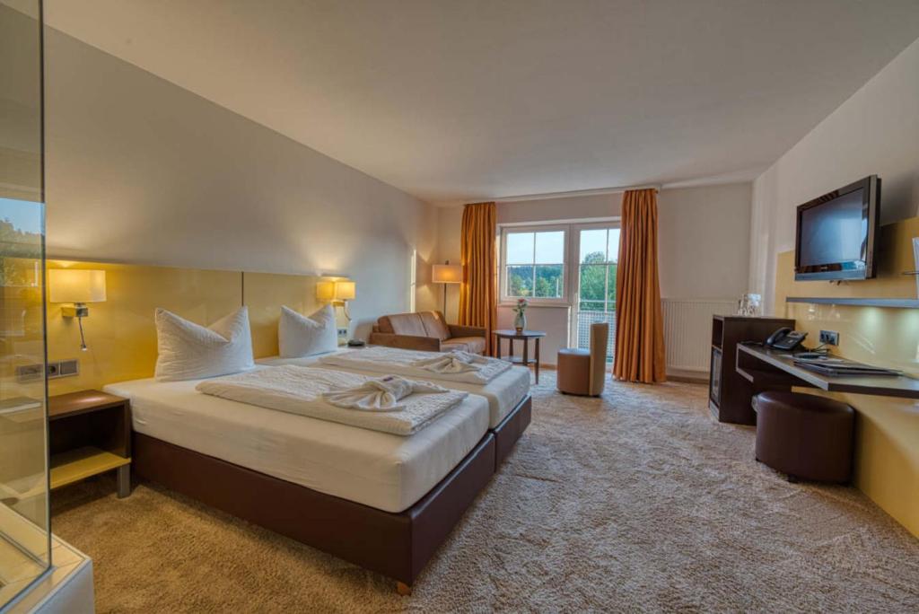 Postel nebo postele na pokoji v ubytování Hotel & SPA Reibener-Hof