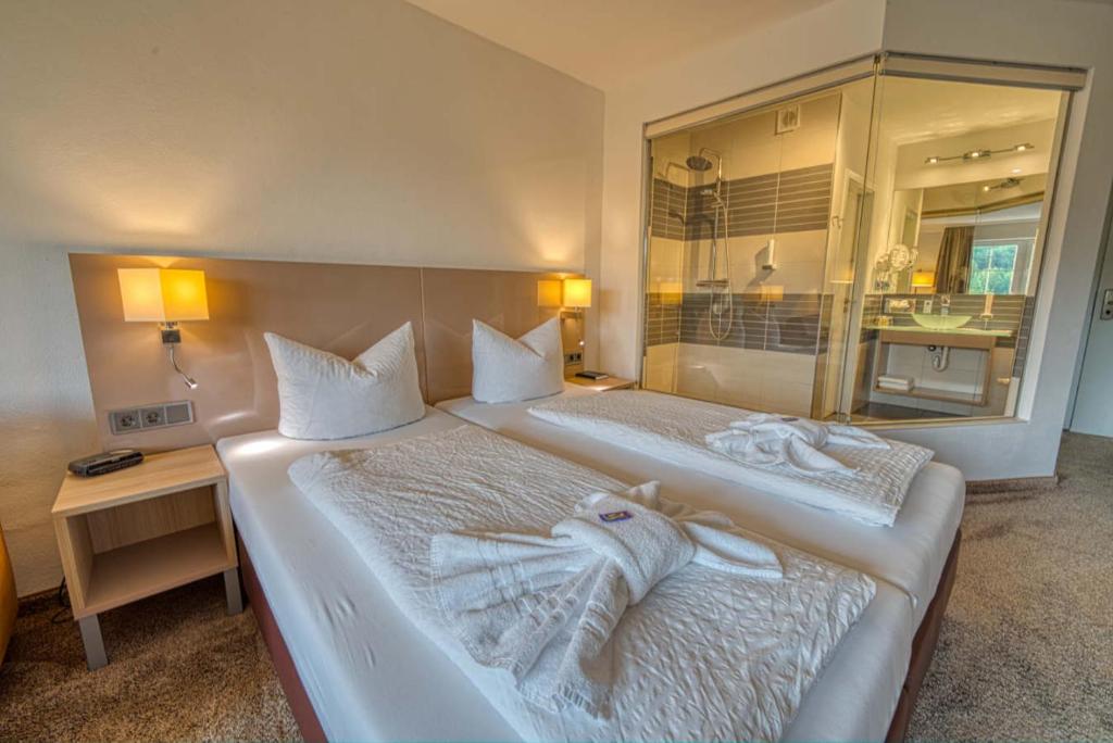 Postel nebo postele na pokoji v ubytování Hotel & SPA Reibener-Hof