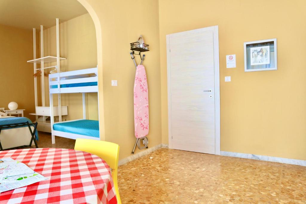 a room with a bedroom with a bed and a door at Apartment Sonnino 37 in Cagliari