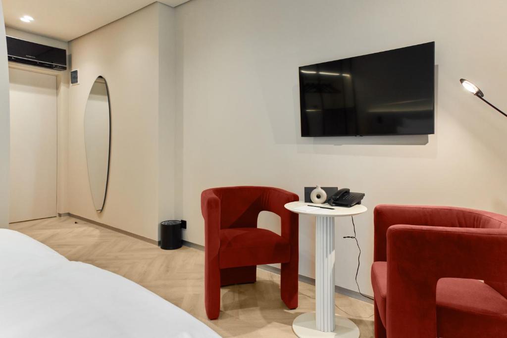 TV a/nebo společenská místnost v ubytování Hotel Laudon