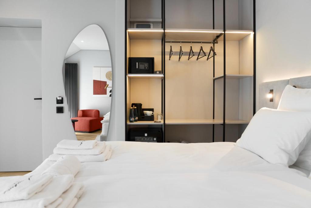 Postel nebo postele na pokoji v ubytování Hotel Laudon
