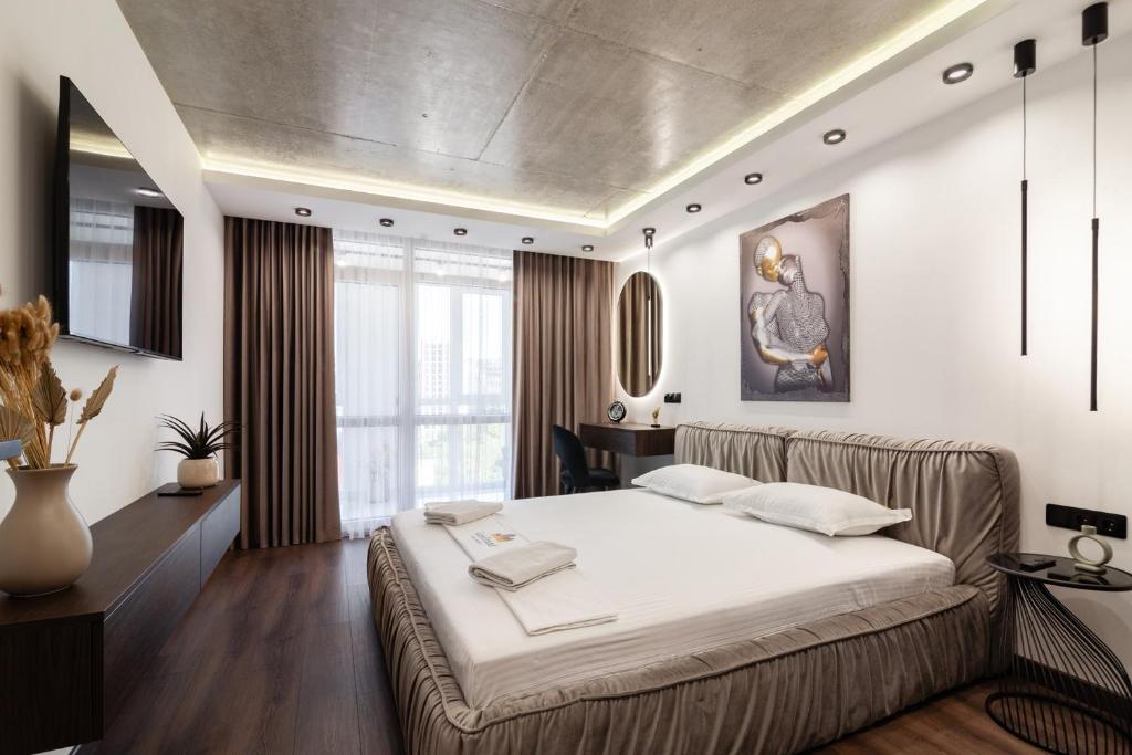 Posteľ alebo postele v izbe v ubytovaní LEOGRAND Jacuzzi on Shevchenka 31a