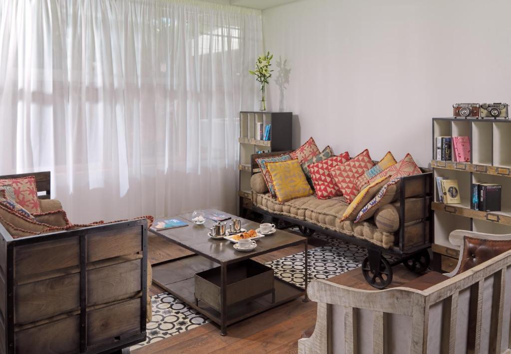 a living room with a couch and a table at H10 Ocean Suites in Corralejo